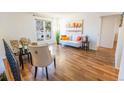 Bright living room with hardwood floors, large window, and comfortable seating arrangement at 2161 Bowen St, Longmont, CO 80501