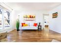 Inviting living room featuring hardwood flooring, a large window, and neutral decor at 2161 Bowen St, Longmont, CO 80501