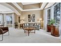 Bright living room featuring high ceilings, large windows, and comfortable seating area at 3163 Soaring Eagle Ln, Castle Rock, CO 80109