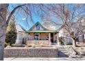 Charming home with a front porch, brick foundation, and traditional architectural style at 2215 Meade St, Denver, CO 80211