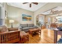 Inviting living room featuring hardwood floors and open layout to the dining area at 2215 Meade St, Denver, CO 80211