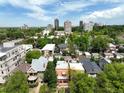 Wide aerial view showcasing neighborhood and proximity to downtown with blue skies and greenery at 1258 N Downing St, Denver, CO 80218