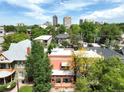 Scenic view of the property in a neighborhood with lush greenery and city skyline backdrop at 1258 N Downing St, Denver, CO 80218