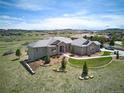 Aerial view showcasing this gorgeous home's roof, landscaping, and location on a golf course at 5195 Raintree Cir, Parker, CO 80134