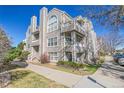 Attractive multi-story condominium building showcasing balconies and manicured landscaping at 5706 W Asbury Pl # 205, Lakewood, CO 80227