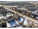 Aerial view of the home showing its location within the community, nearby roads, and surrounding houses at 16102 Grebe Pl, Parker, CO 80134