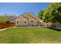 Spacious backyard with lush green lawn and patio perfect for outdoor entertaining at 16102 Grebe Pl, Parker, CO 80134