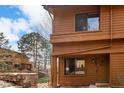 Charming exterior view of a brown two-story home with a welcoming front door at 9400 E Iliff Ave # 103, Denver, CO 80231