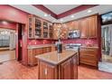 Gourmet kitchen featuring custom cabinets, granite countertops, and stainless steel appliances at 1563 N Lafayette St, Denver, CO 80218