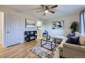 Inviting living room featuring hardwood floors, modern furnishings, and a ceiling fan at 110 E 104Th Pl, Northglenn, CO 80233