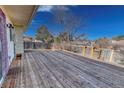 Wide angle view of wooden deck, ready for entertaining and relaxation at 1167 S Ceylon St, Aurora, CO 80017