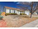 Charming single-story home with manicured lawn and attached two-car garage at 1167 S Ceylon St, Aurora, CO 80017