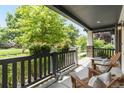 Relaxing front porch with Adirondack chairs, decorative plants, and a view of the neighborhood at 3858 W 117Th Ct, Westminster, CO 80031