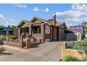 Brick house with driveway and attached garage at 3041 W 40Th Ave, Denver, CO 80211