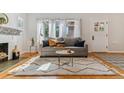 Bright living room with fireplace and hardwood floors at 3041 W 40Th Ave, Denver, CO 80211