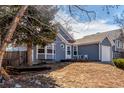 View of home with small, quaint front porch and garden at 17665 E Temple Dr, Aurora, CO 80015