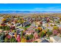Property view showcasing home, neighborhood, and mountain views at 449 Meadow View Pkwy, Erie, CO 80516