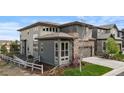 Beautiful home with large windows, neutral siding, and a two-car garage at 507 Red Thistle Dr, Highlands Ranch, CO 80126