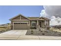 Attractive single-Gathering home with a two-car garage and low maintenance front yard at 483 Agoseris Way, Castle Rock, CO 80104