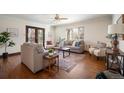 Comfortable living room with ample seating, hardwood floors, and natural light at 6 Ivy Ln, Denver, CO 80220