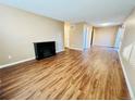 Bright and open living room with wood floors and a charming electric fireplace at 1049 W 112Th Ave # A, Denver, CO 80234