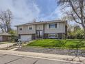 Attractive home featuring a lush lawn, charming exterior, and a welcoming neighborhood feel at 1488 W 102Nd Ave, Northglenn, CO 80260