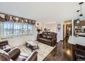 Inviting living room with hardwood floors, stylish furniture, and abundant natural light at 1488 W 102Nd Ave, Northglenn, CO 80260