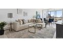 Bright living room with a comfortable sectional sofa, stylish decor, and a view at 1201 N Williams St # 3A, Denver, CO 80218