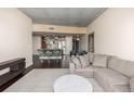 Open concept living space showcasing a comfortable sofa and kitchen at 891 14Th St # 3807, Denver, CO 80202