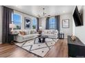Inviting living room featuring stylish furnishings, ample natural light, and a comfortable seating arrangement at 2121 Barnwood Dr, Brighton, CO 80601