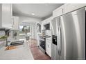 Modern kitchen with stainless steel appliances, white countertops, and a breakfast nook at 4882 W 68Th Ave # 4, Westminster, CO 80030