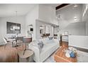 Open-concept living and dining area with hardwood floors and ample natural light at 4882 W 68Th Ave # 4, Westminster, CO 80030