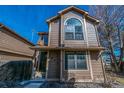 Exterior view of a two-story home featuring a cozy entrance and manicured landscape at 1832 S Quintero Way, Aurora, CO 80017