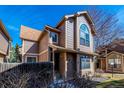 Charming multi-story home featuring unique architectural elements and a well-maintained front yard at 1832 S Quintero Way, Aurora, CO 80017