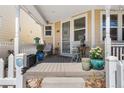 Inviting front porch with outdoor seating and decorative plants, perfect for relaxing at 2846 Central Park Blvd, Denver, CO 80238