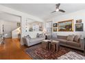 Bright living room featuring hardwood floors, modern furnishings, and decorative artwork at 2846 Central Park Blvd, Denver, CO 80238
