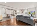 Open concept living room with modern furnishings, hardwood floors, and ample natural light at 4120 S Lincoln S St, Englewood, CO 80113