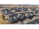 An aerial view of the real estate development with well-maintained lawns and landscaping near the city at 14434 W 88Th Dr # B, Arvada, CO 80005