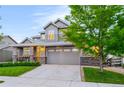 Beautiful two-story home with a two-car garage, landscaped yard, and welcoming curb appeal at 4738 Colorado River Dr, Firestone, CO 80504