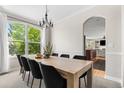 Elegant dining room boasts a large window, chandelier, and a spacious table perfect for hosting gatherings at 20740 Parker Vista Rd, Parker, CO 80138