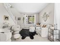 Bright living room with ample seating, natural light, and stylish decor at 20740 Parker Vista Rd, Parker, CO 80138