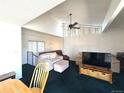 Bright living room with a ceiling fan, large windows, and comfortable seating area at 2986 W 119Th Ave, Westminster, CO 80234