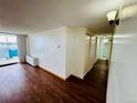 Bright room with wood floors leading to a private balcony with good natural light at 1155 N Ash St # 908, Denver, CO 80220