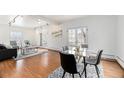 Spacious living room with hardwood floors, marble table and modern furnishings at 960 N Sherman St # 2G, Denver, CO 80203