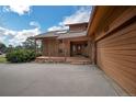 Exterior view showing the porch and covered parking of this stunning home at 6275 Lakewood Rd, Parker, CO 80134