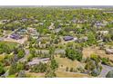 Aerial view of the property and surrounding neighborhood with mature trees and landscaping at 4500 S Dasa Dr, Cherry Hills Village, CO 80111