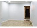 A serene bedroom with wood floors, light blue walls, and an open doorway for a calm and relaxing atmosphere at 3325 Navajo St, Denver, CO 80211