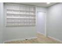 A spacious living room with built-in shelving, wood floors, and ample space for comfortable living and storage at 3325 Navajo St, Denver, CO 80211