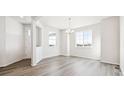 Bright dining room with hardwood floors and large windows at 24955 E 41St Ave, Aurora, CO 80019