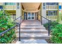 The entrance of 350 S Clinton St features a brick design, beautiful stairway, and glass doors for a stunning visual at 350 S Clinton St # 9B, Denver, CO 80247
